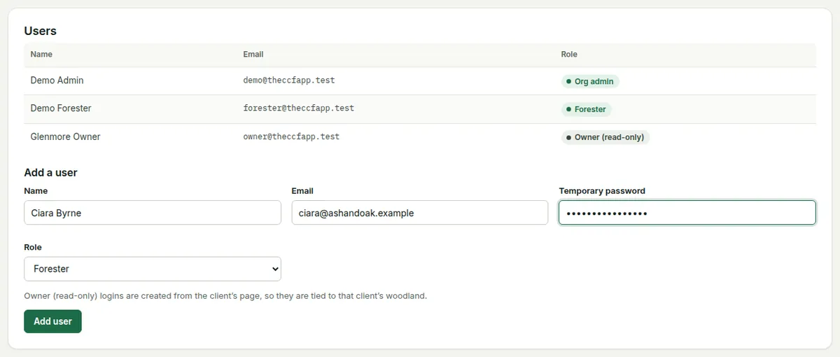 The Organisation page: the users table with role chips and the Add a user form with name, email, temporary password and role.