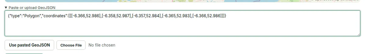 The Paste or upload GeoJSON panel under the boundary map, with a pasted polygon, the Use pasted GeoJSON button and a file picker.